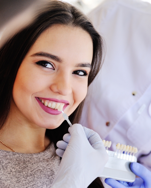 Young woman getting veneers from her cosmetic dentist in Mesa