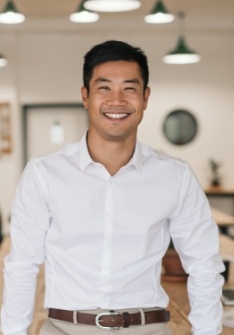 Man in white button down shirt smiling