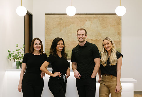 Smiling dentist and team members at Julian Dentistry in Mesa