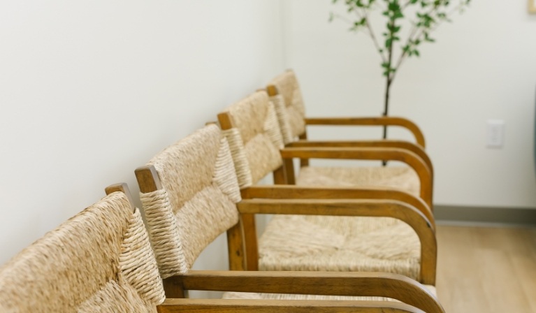 Close up of wicker and wood chairs