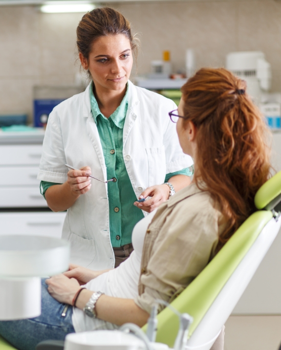 Dentist talking to a patient about root canal treatment in Mesa