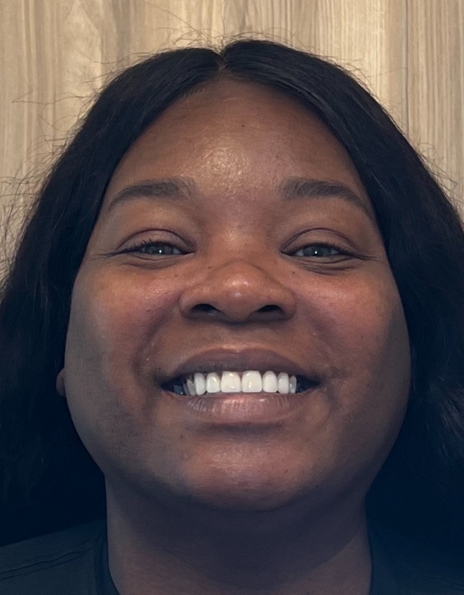 Smiling woman with more well aligned teeth