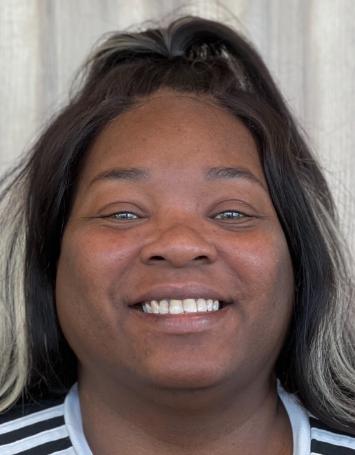 Smiling woman with slightly uneven teeth